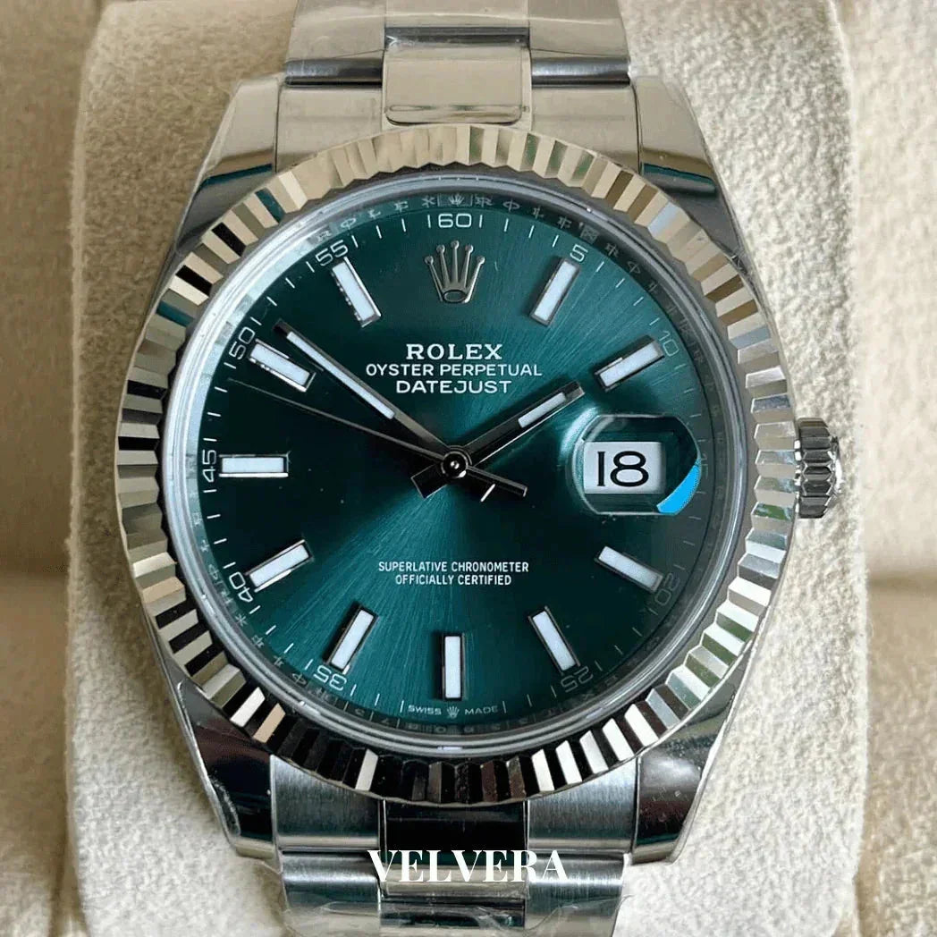 Rolex Datejust Oyster Perpetual watch with green dial, stainless steel bracelet, close-up