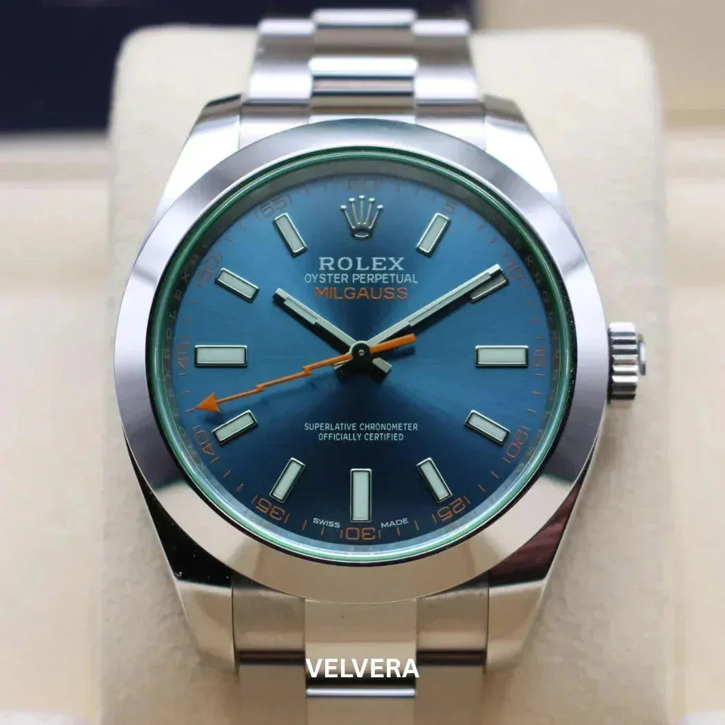 Rolex Oyster Perpetual Milgauss watch with blue dial, stainless steel bracelet, and orange accents