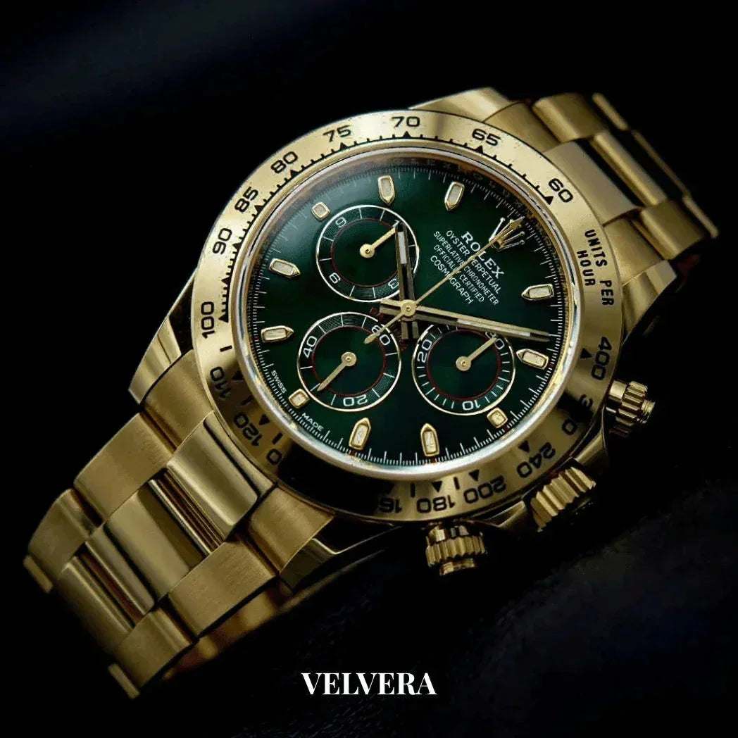 Gold Rolex chronograph watch with green dial on black background, luxury Velvera branding