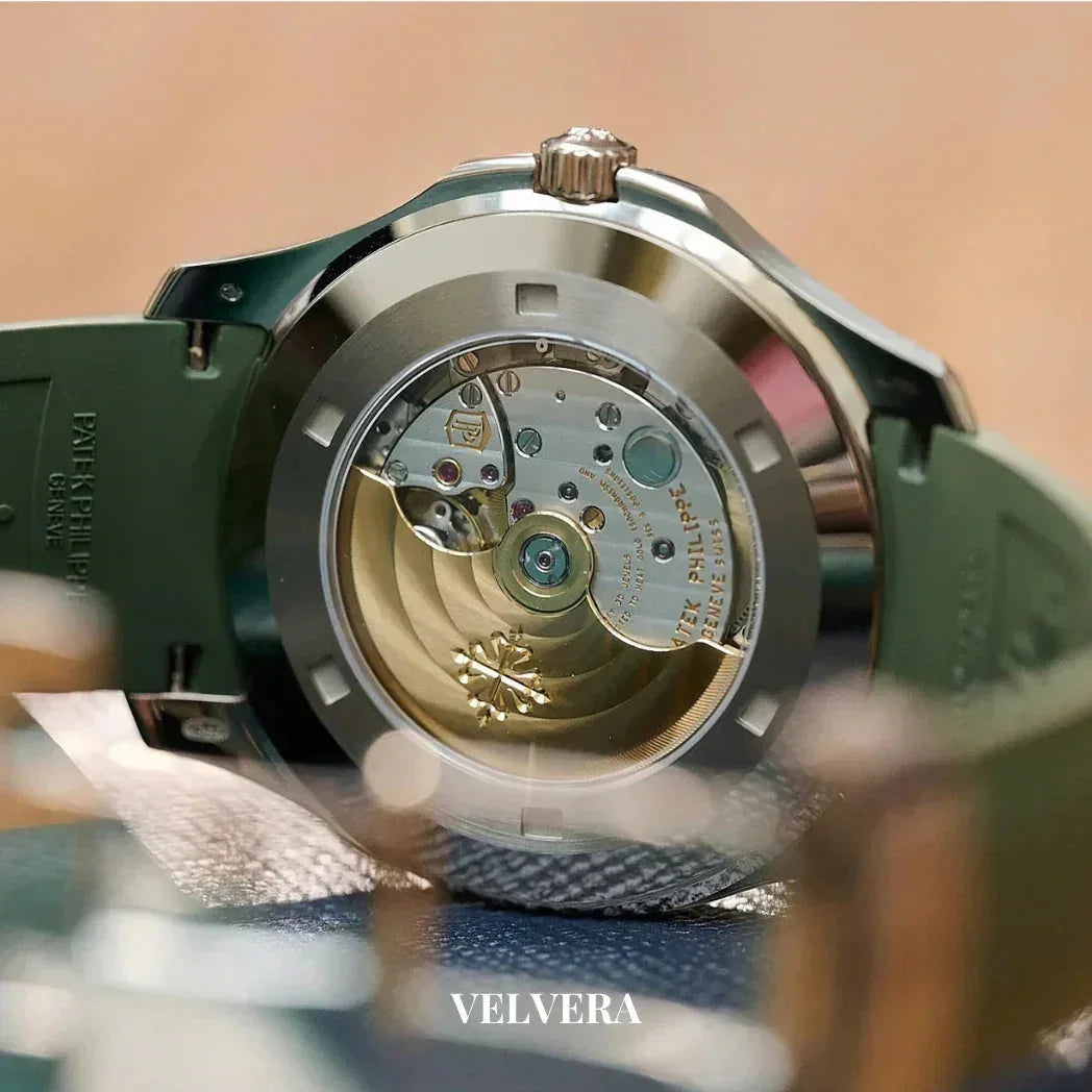 Luxury Patek Philippe watch movement with green strap and engraved gold rotor, VELVERA branding
