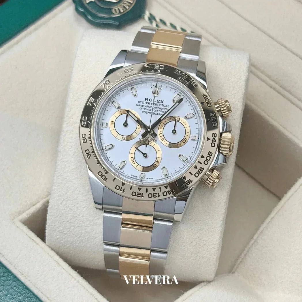 Rolex Daytona two-tone gold and silver chronograph watch with white dial on cushion in box