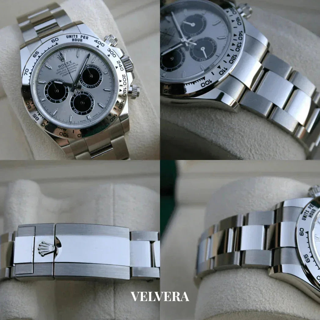 Stainless steel Rolex Daytona chronograph watch close-up on light display, Velvera branding