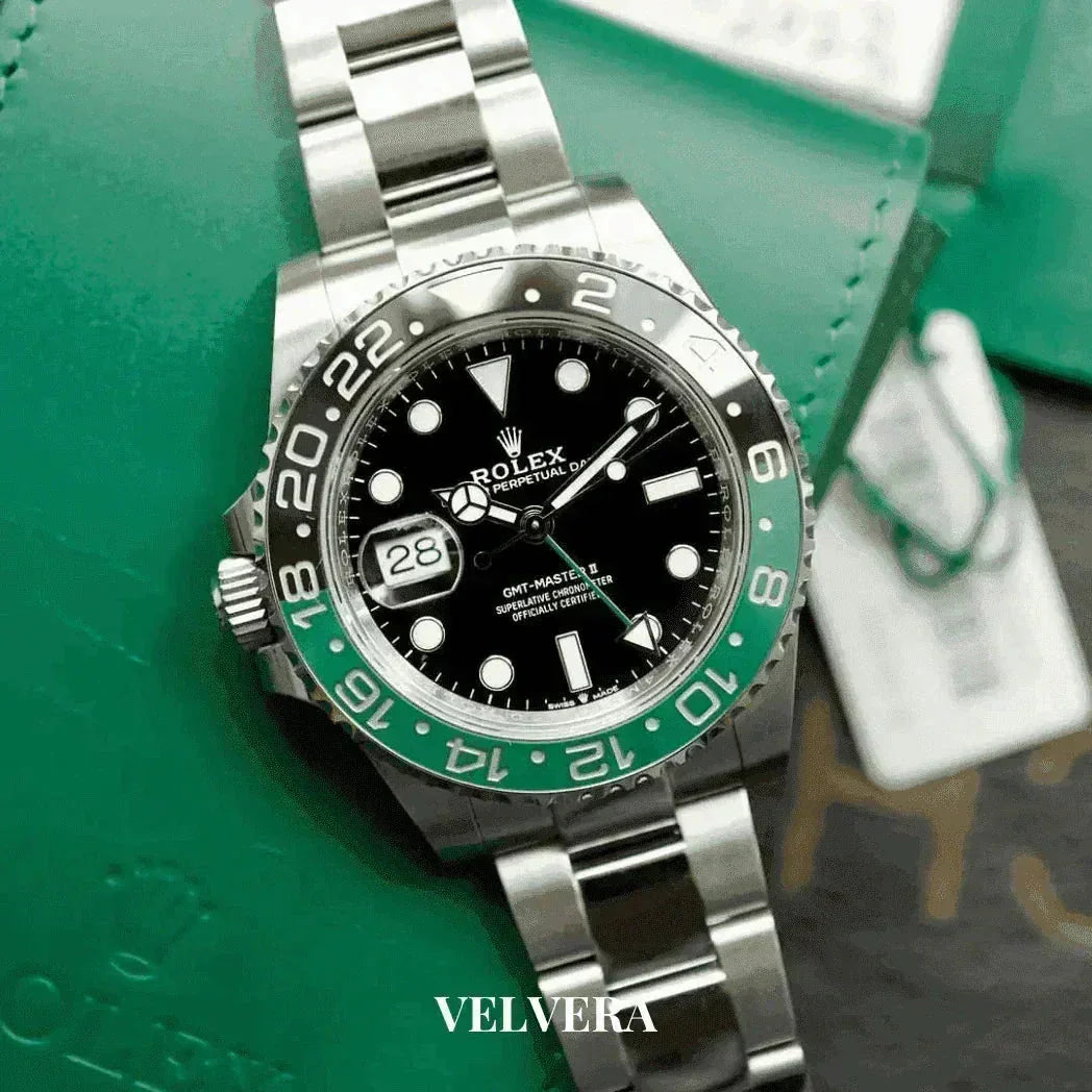 Rolex GMT-Master II stainless steel green bezel watch on green leather pouch, VELVERA