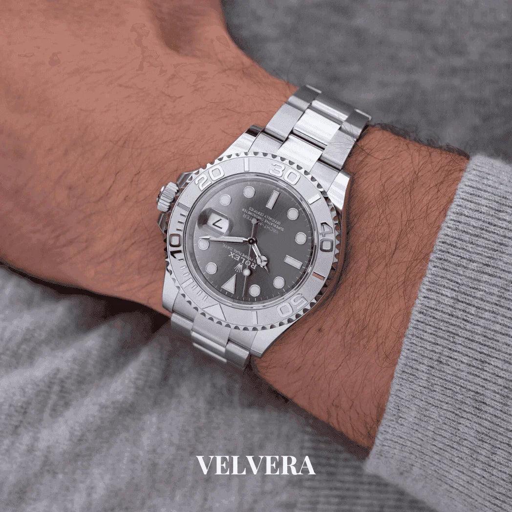 Silver Rolex Yacht-Master watch on wrist, stainless steel bracelet, grey dial, Velvera
