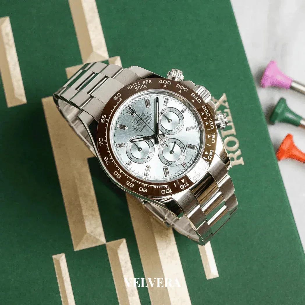 Rolex Daytona stainless steel chronograph watch with ice blue dial on green Rolex box
