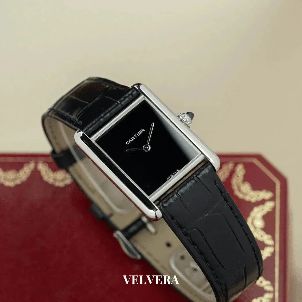 Cartier Tank Must black dial watch with black leather strap on red decorative box