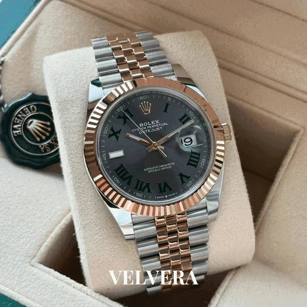 Rolex Datejust two-tone watch with black dial and Roman numerals in a beige display box