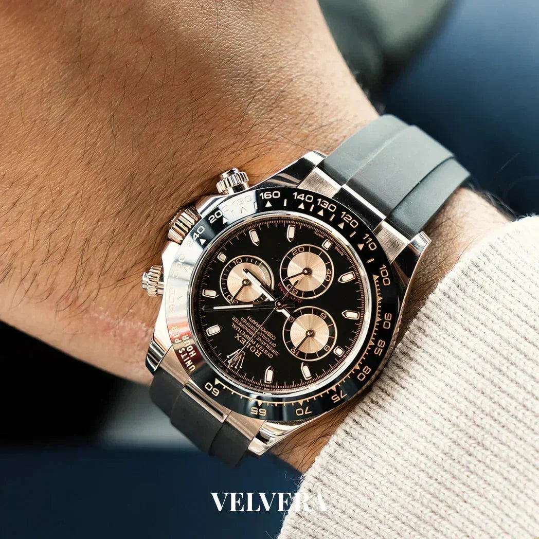 Luxury black chronograph watch with rubber strap on wrist, VELVERA branding visible