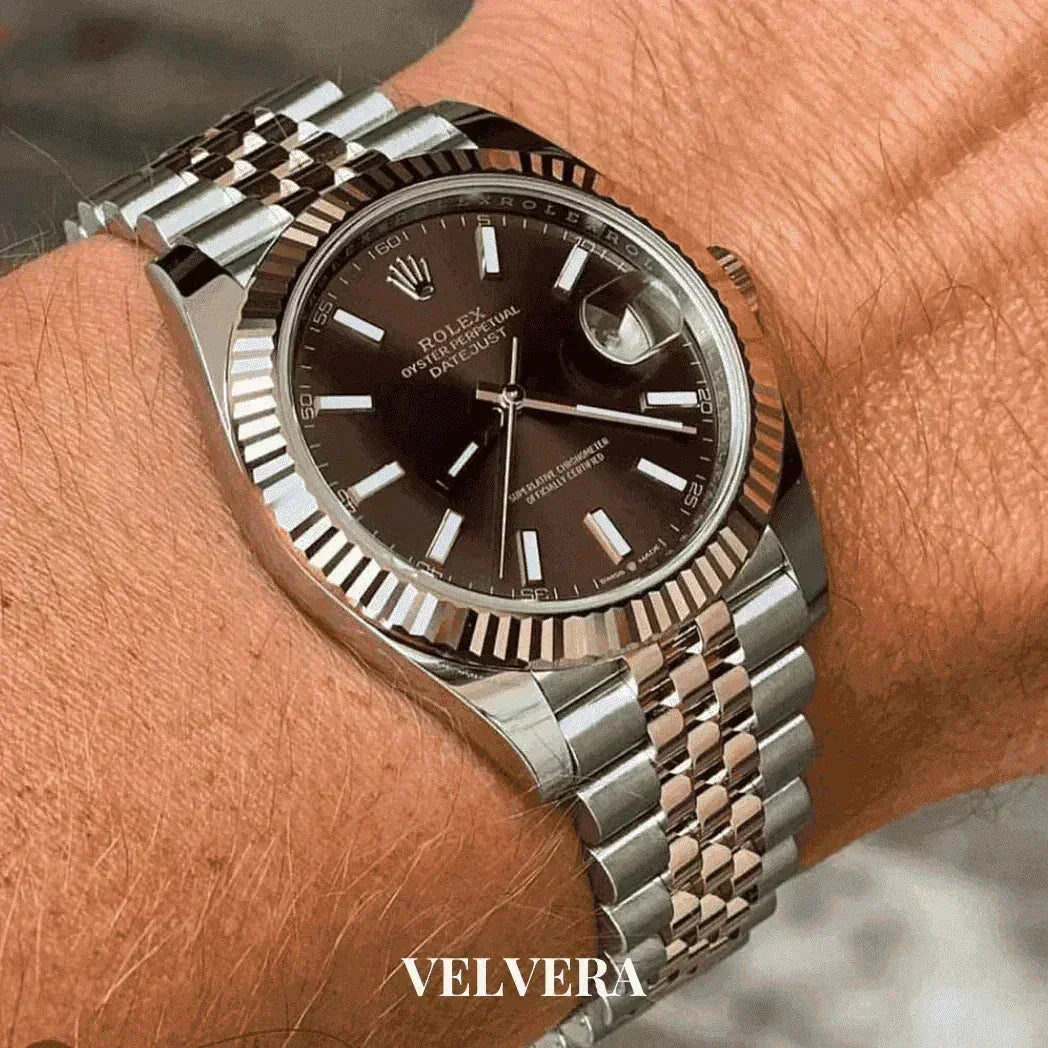 Luxury Rolex Datejust watch with black dial and silver jubilee bracelet on wrist, Velvera logo