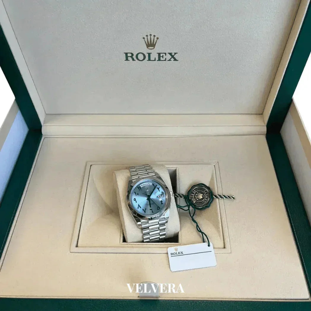 Rolex Day-Date watch with Arabic blue dial in a green and beige Rolex box, Velvera branding