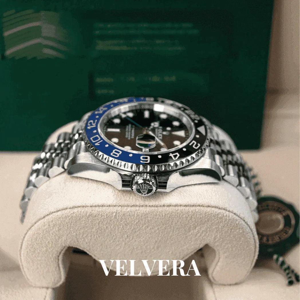 Luxury Rolex GMT-Master II watch with blue-black bezel on display cushion, Velvera branding