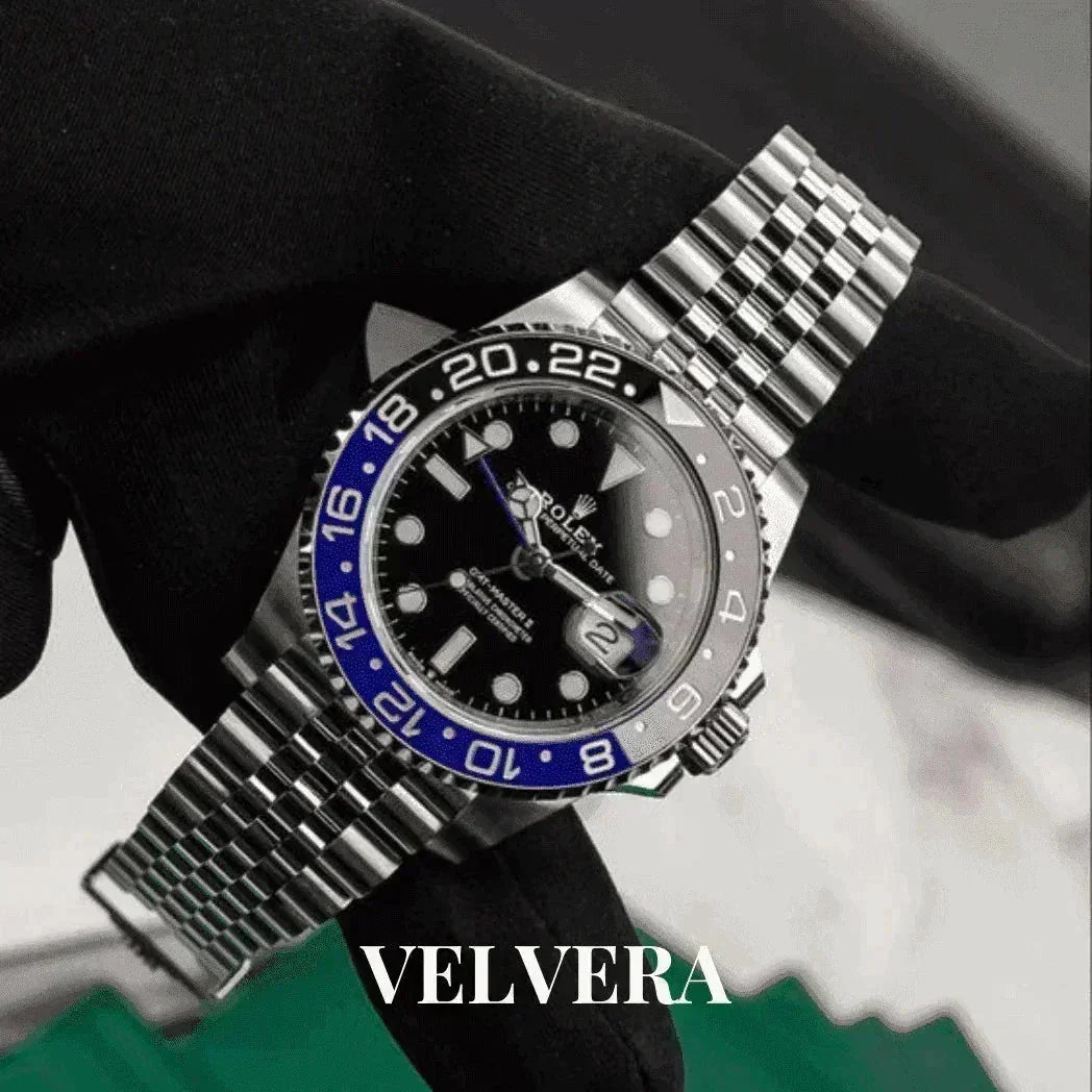 Rolex GMT-Master II Batman 126710BLNR Jubilee watch held by gloved hand, VELVERA branding