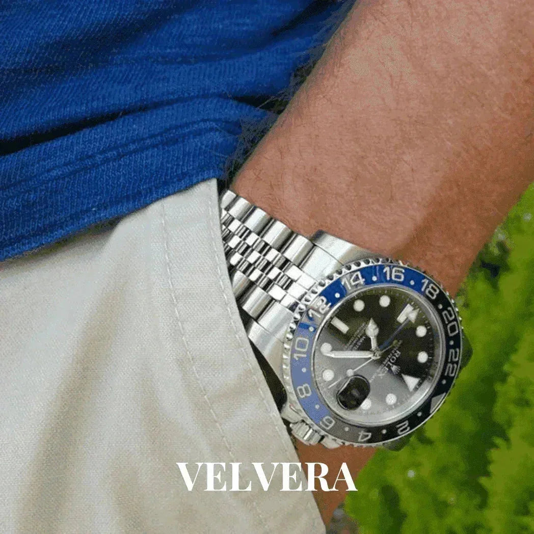 Rolex GMT-Master II Batman watch on wrist with Jubilee bracelet, blue shirt, beige shorts, VELVERA
