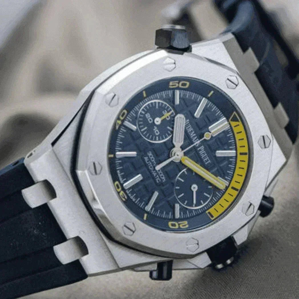 Luxury men's watch with octagonal steel case, black strap, blue dial, chronograph and yellow accents