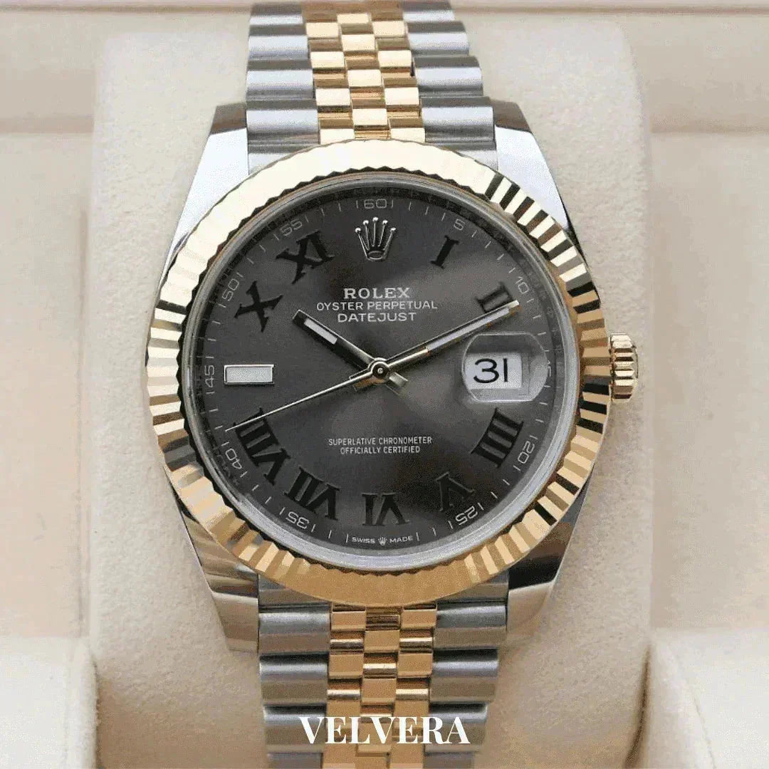 Rolex Datejust Wimbledon men's watch with gold and silver jubilee bracelet on display.