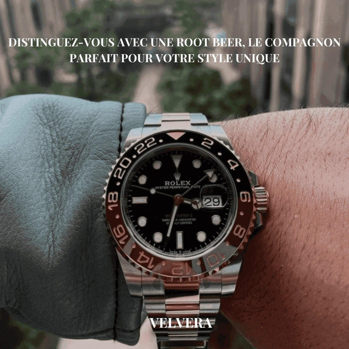 Rolex GMT-Master II Root Beer watch on wrist with city view background, Velvera branding