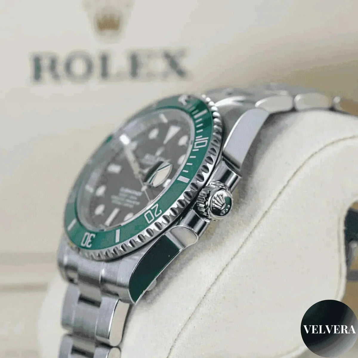 Rolex Submariner Hulk 116610LV green bezel men's watch on display, Velvera branding visible