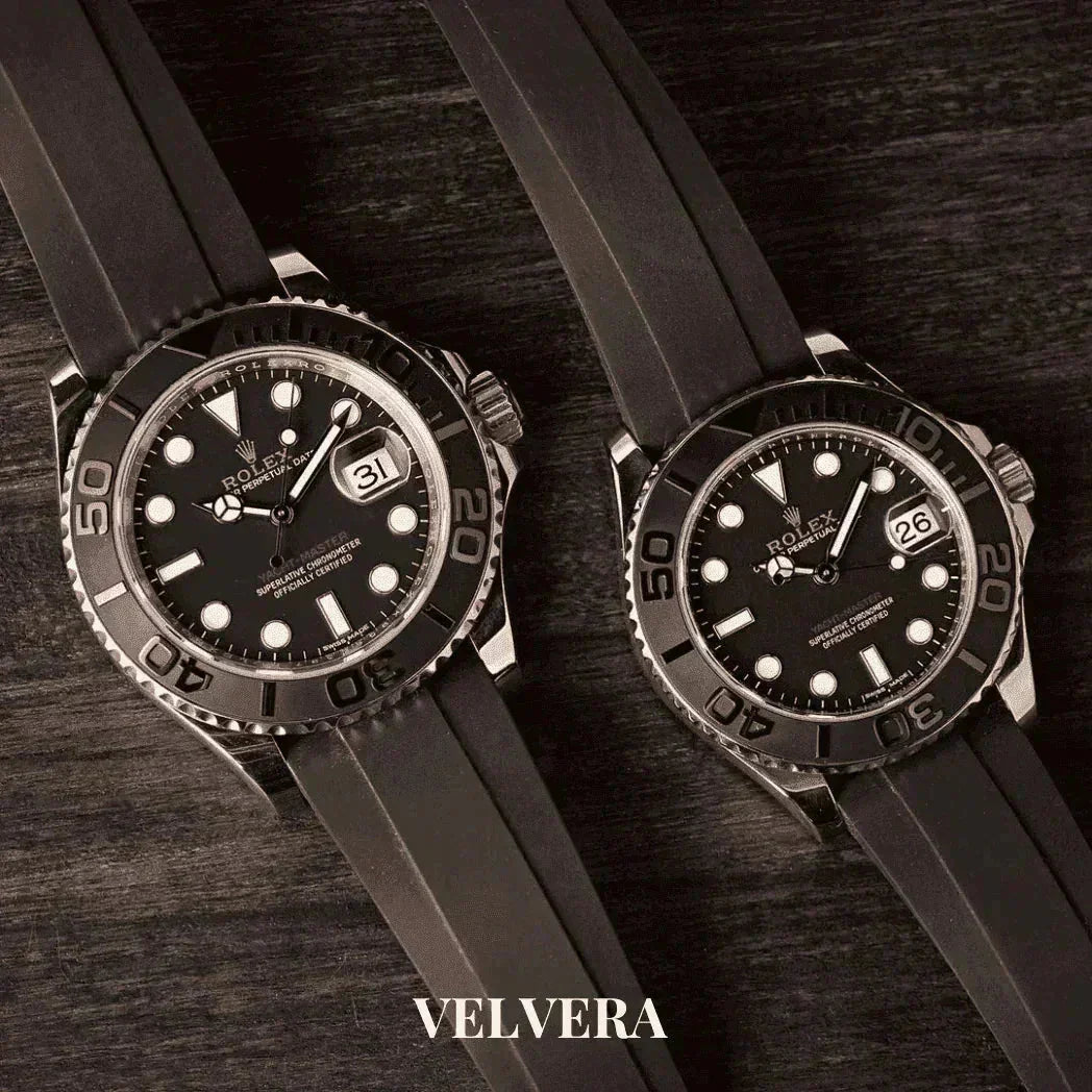 Rolex Yacht-Master Oysterflex men's watches with black dials on dark wood by Velvera