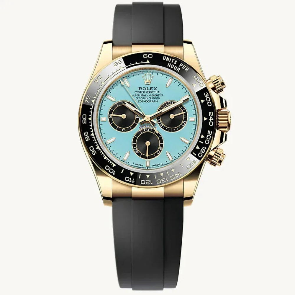Luxury gold Rolex Daytona watch with turquoise dial, black bezel, and black rubber strap