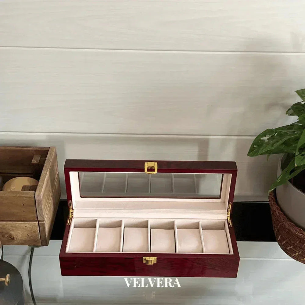 Velvera wooden watch box with glass lid and six compartments on a modern shelf