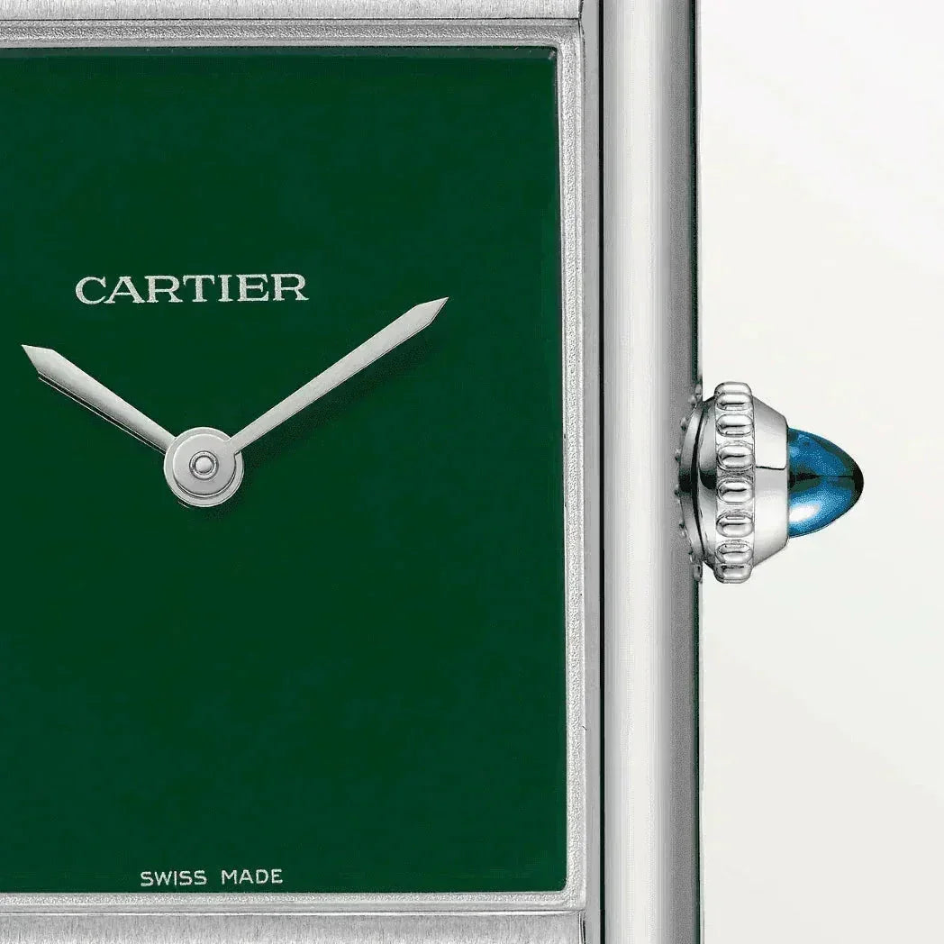 Cartier Tank wristwatch with green dial, silver hands, and blue cabochon crown