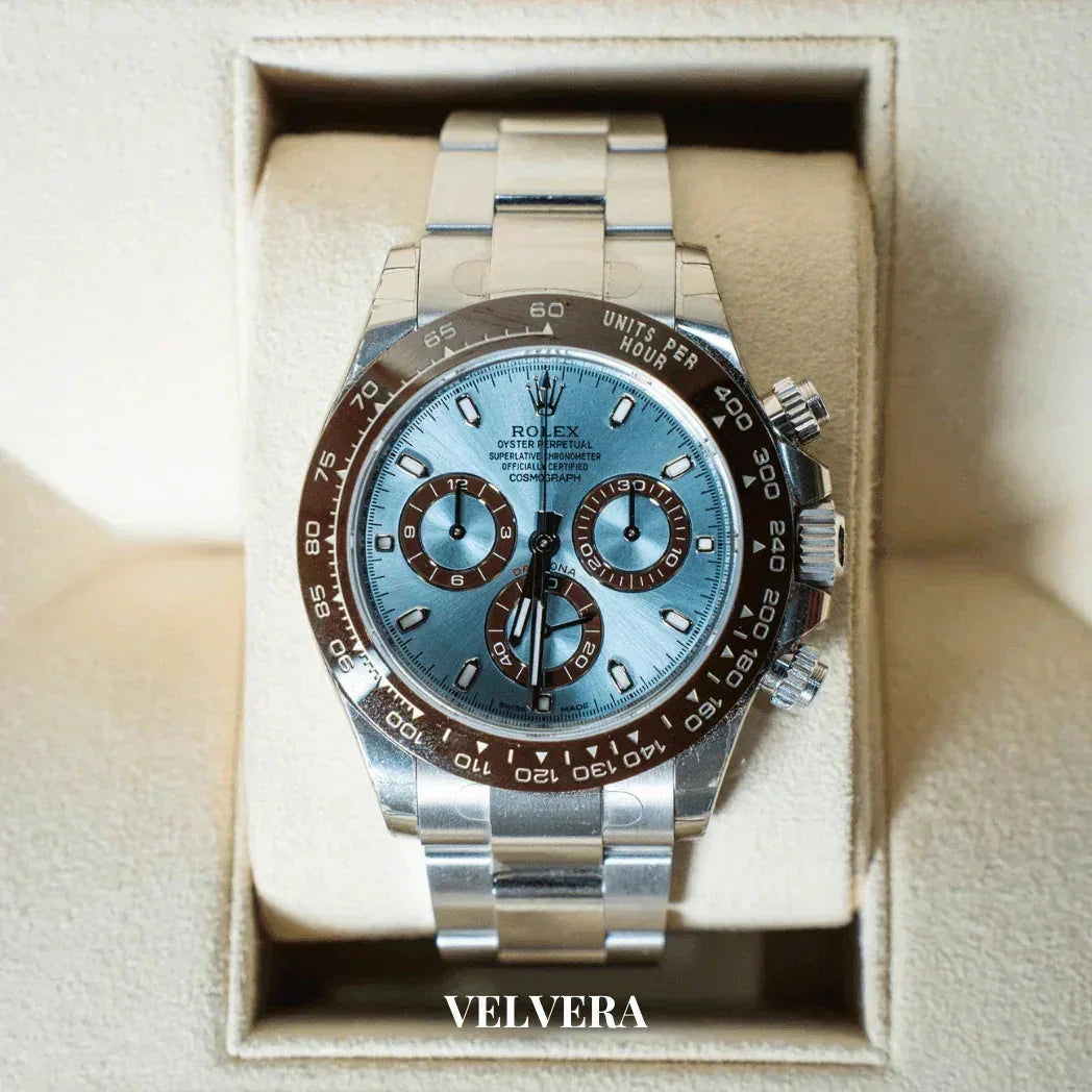 Rolex Daytona watch with blue dial and brown bezel in velvet display case, Velvera branding