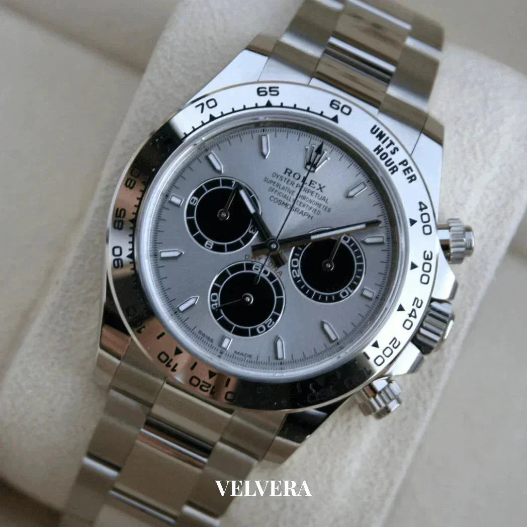 Silver Rolex Daytona chronograph watch with black subdials on a stainless steel band