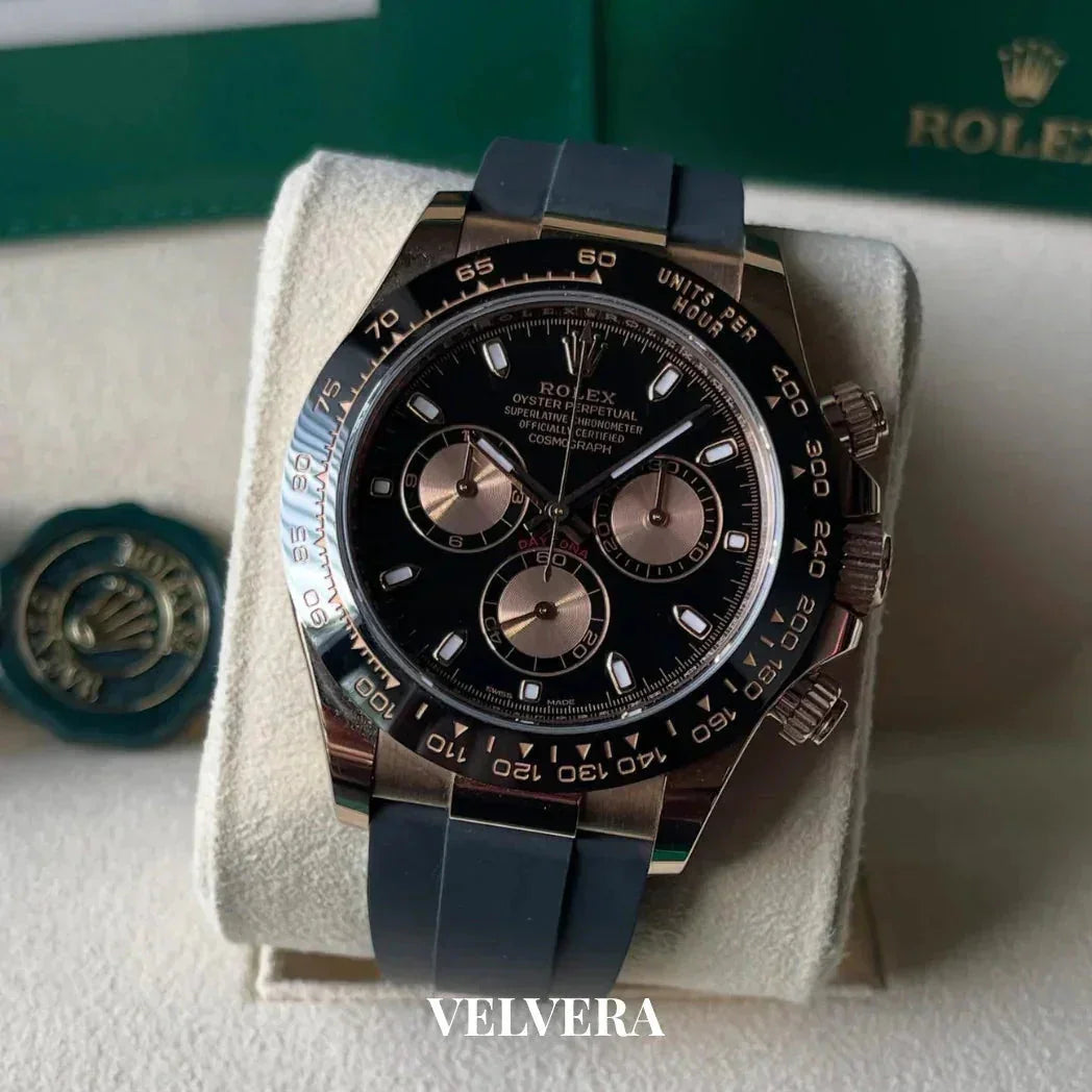 Rolex Daytona black dial watch with rubber strap on display, luxury timepiece, Velvera