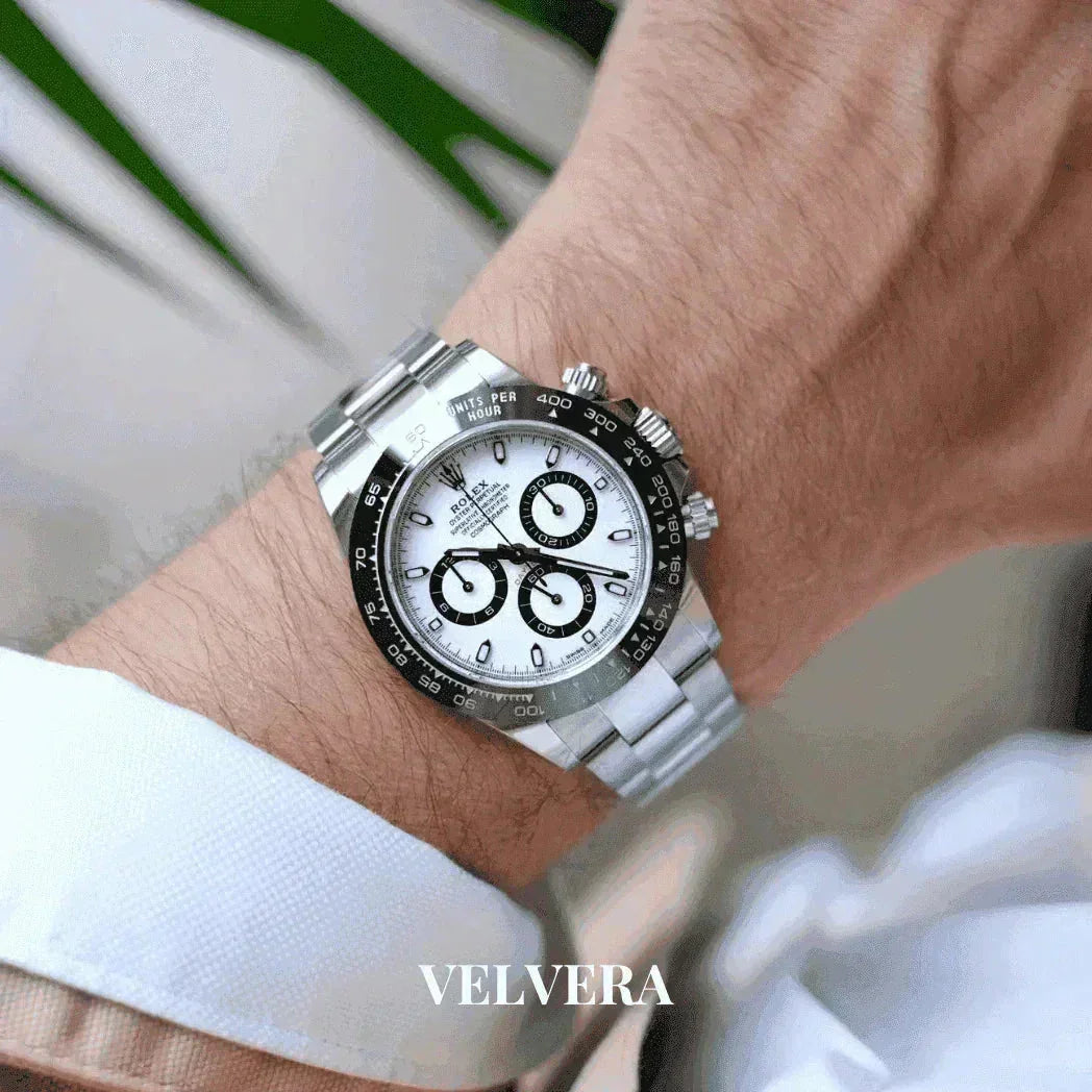 Luxury stainless steel chronograph watch with white dial on wrist, VELVERA branding visible
