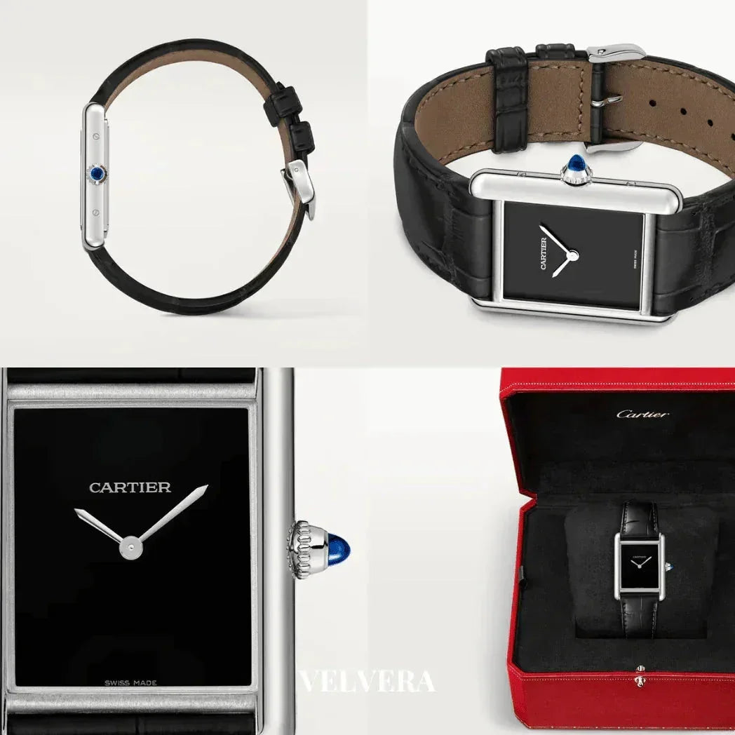 Cartier Tank Must black dial watch with leather strap, silver case, and blue crown, shown in box.