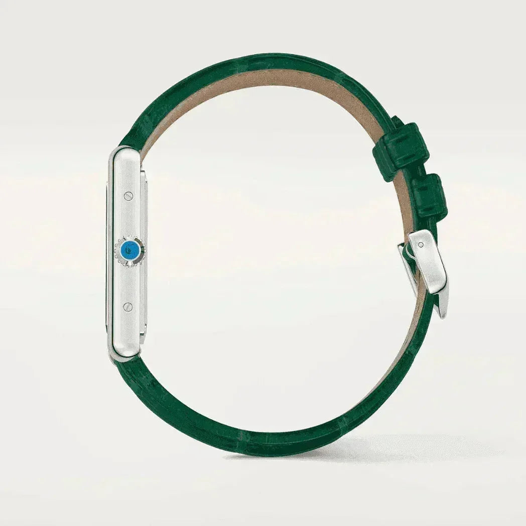 Side view silver watch with green leather strap on white background