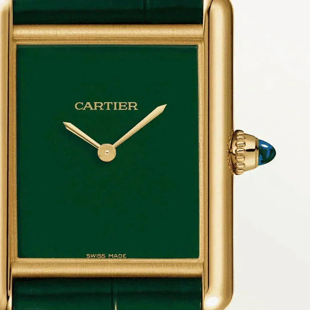 Cartier Tank watch with green dial, gold case, and green leather strap