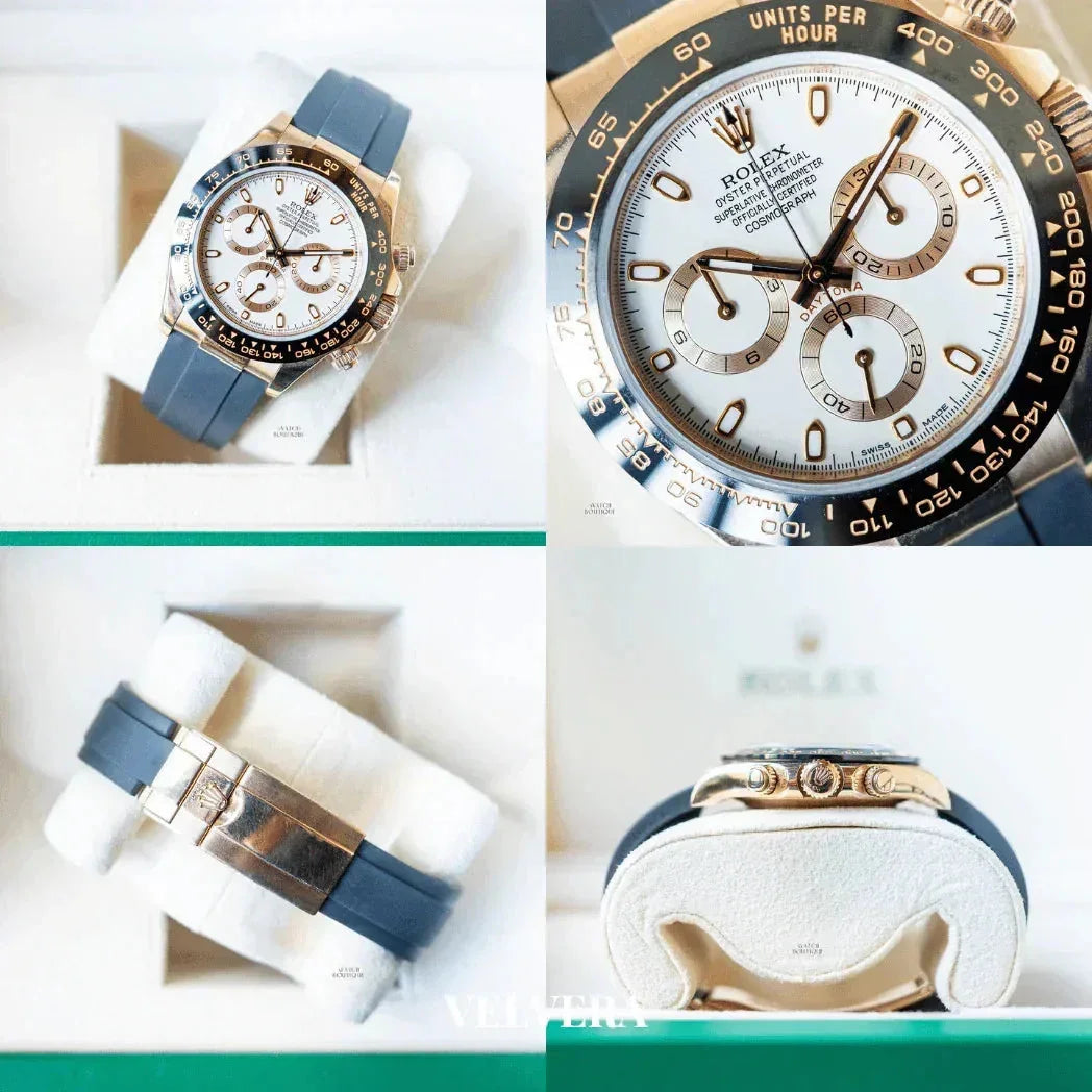 Rolex Daytona watch with black bezel, white dial, and rubber strap in display box