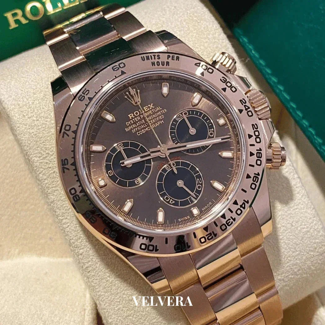Rolex Daytona rose gold chronograph watch on display in velvet jewelry box