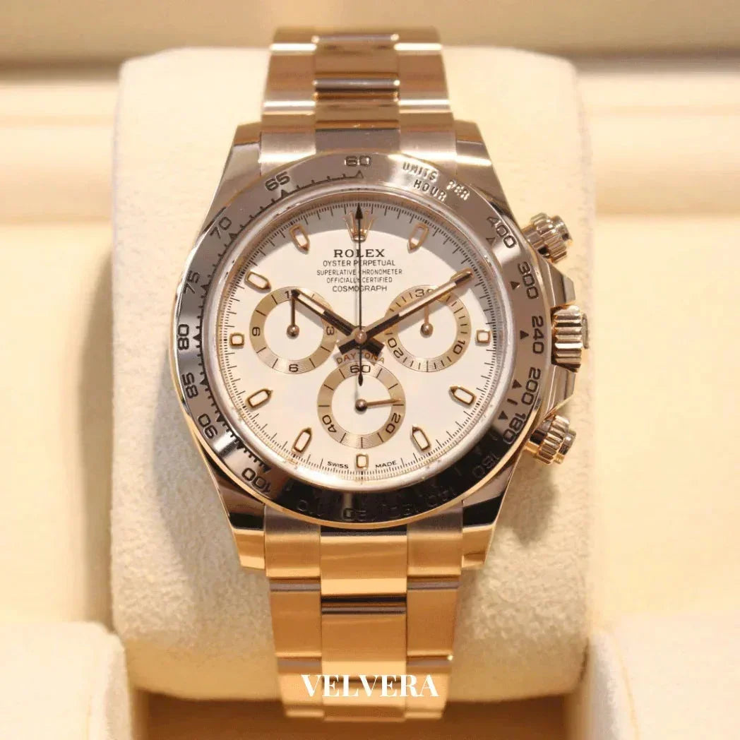 Rolex Cosmograph Daytona gold watch with white dial on display, luxury timepiece by Velvera