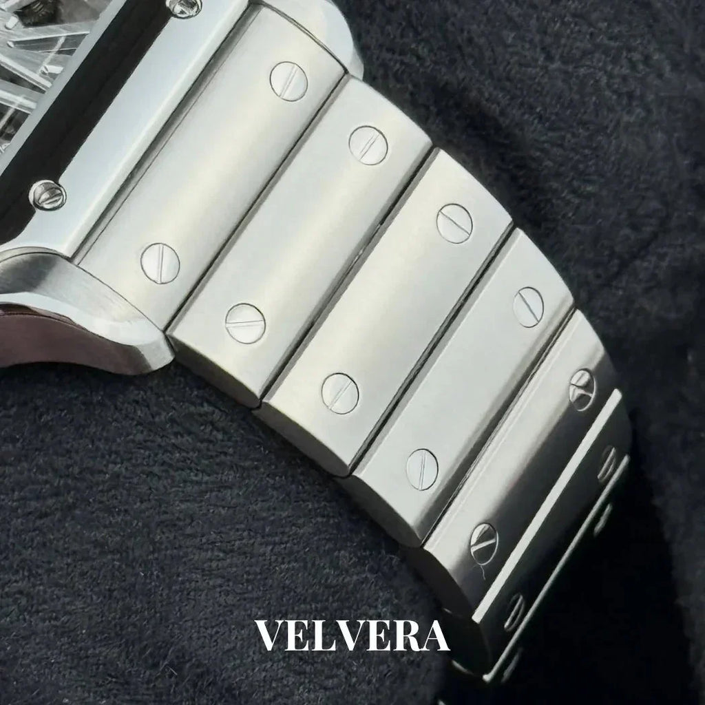 Close-up of Velvera stainless steel watch bracelet with screw details on black fabric.