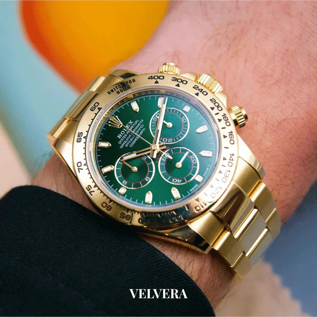 Gold Rolex Daytona watch with green dial on wrist, luxury men's watch, close-up shot