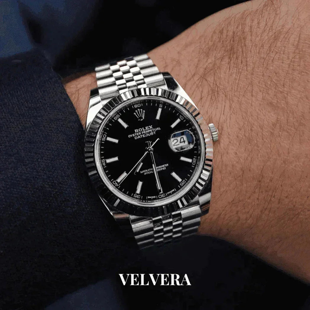 Rolex Datejust black dial stainless steel watch on wrist, Velvera branding below