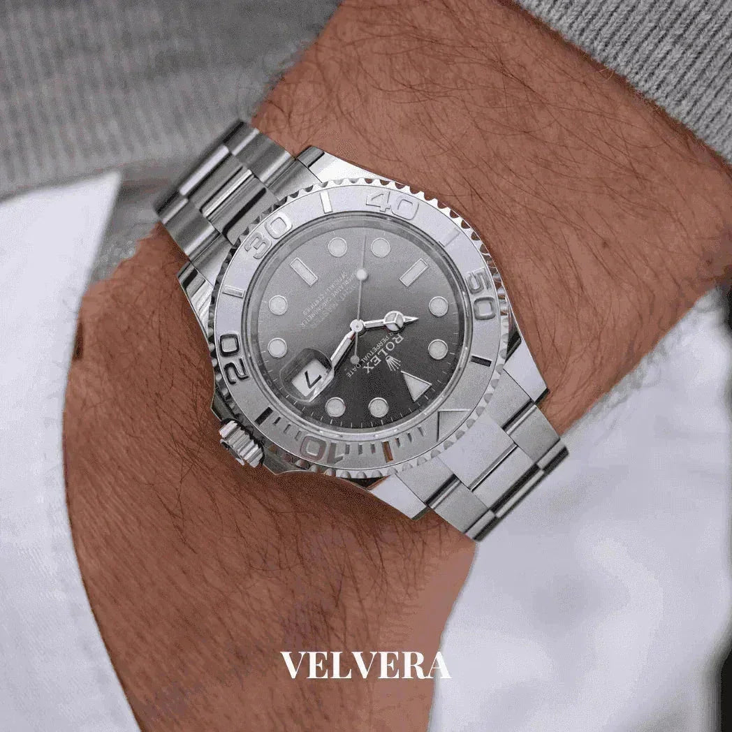 Silver Rolex Yacht-Master watch on wrist, luxury stainless steel timepiece, Velvera branding