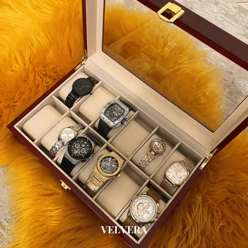 Luxury watch display box with assorted wristwatches on a yellow fur surface, VELVERA logo