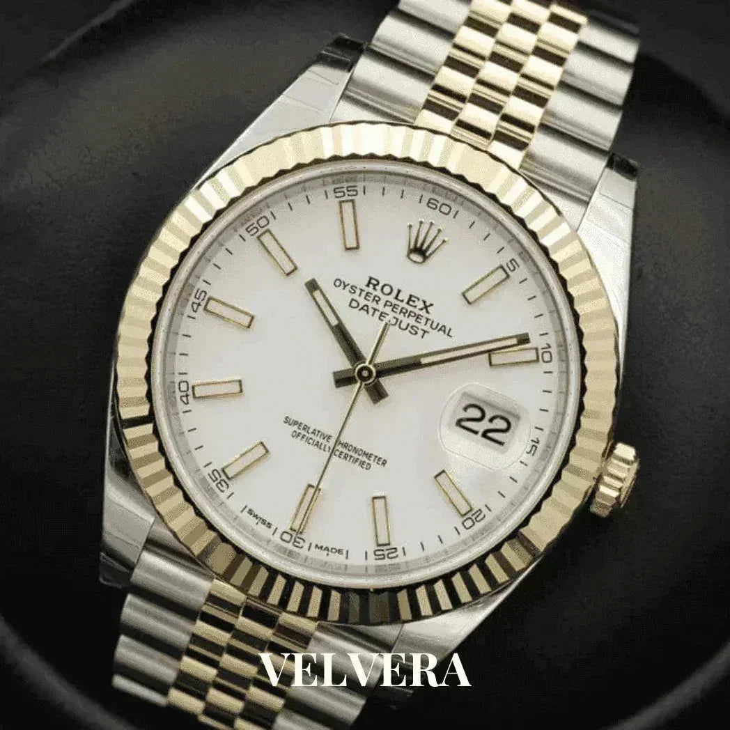 Rolex Datejust 41mm watch with white dial, gold bezel, Jubilee bracelet, close-up, Velvera