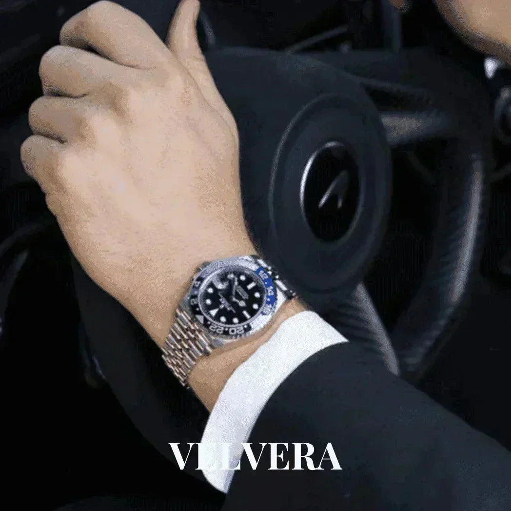 Rolex GMT-Master II Batman watch on wrist, driving luxury car, VELVERA branding visible