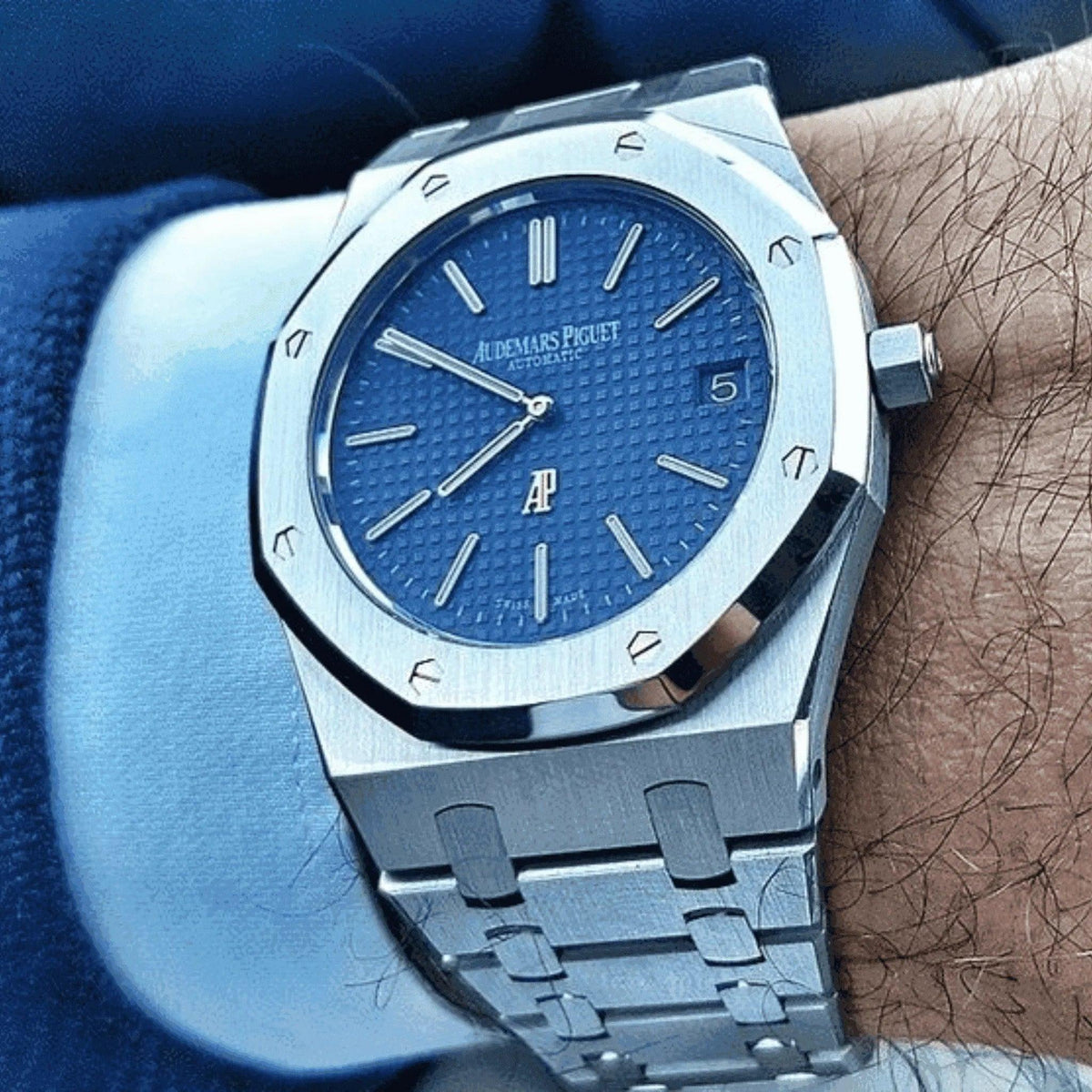 Audemars Piguet Royal Oak blue dial 41mm men's watch on wrist, stainless steel bracelet
