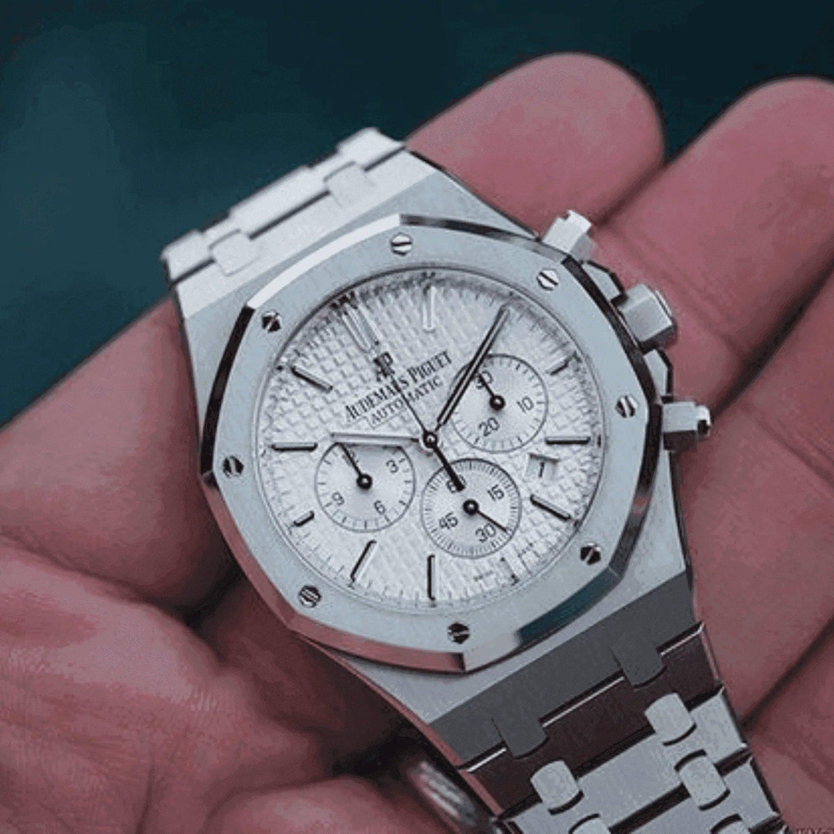 Audemars Piguet Royal Oak Chronograph 41mm silver watch with white dial in hand