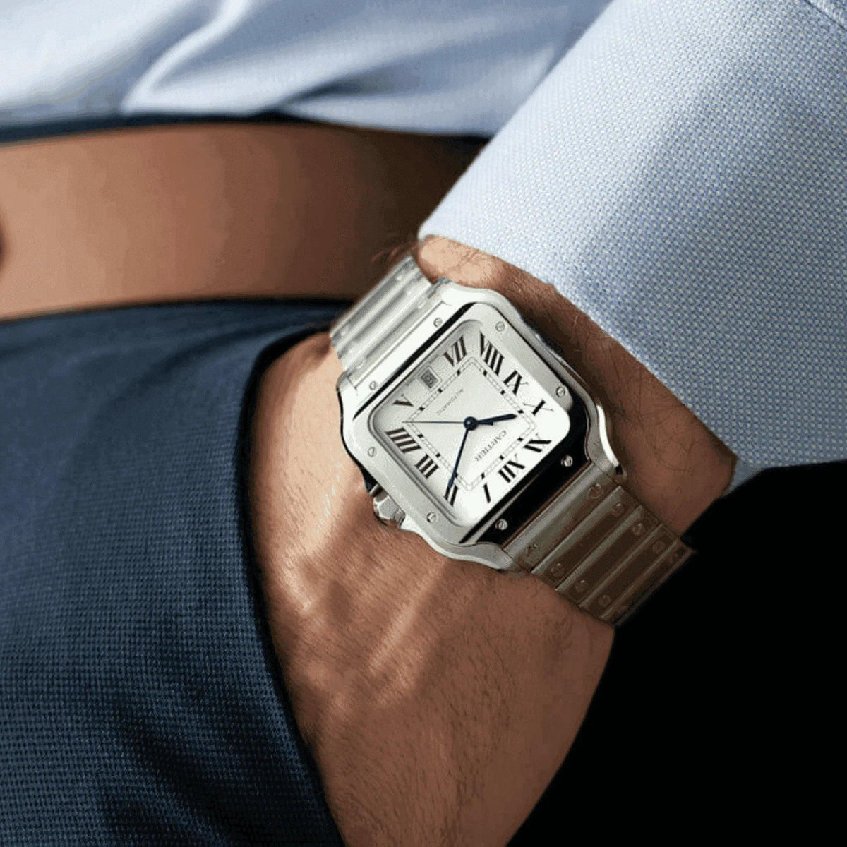 Cartier Santos men's stainless steel watch on wrist, business attire