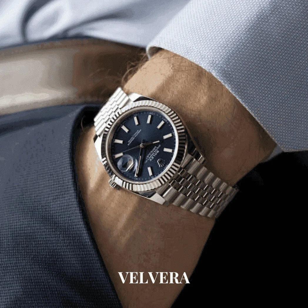 Men's Datejust 41 watch with blue dial and silver bracelet on wrist, Velvera branding