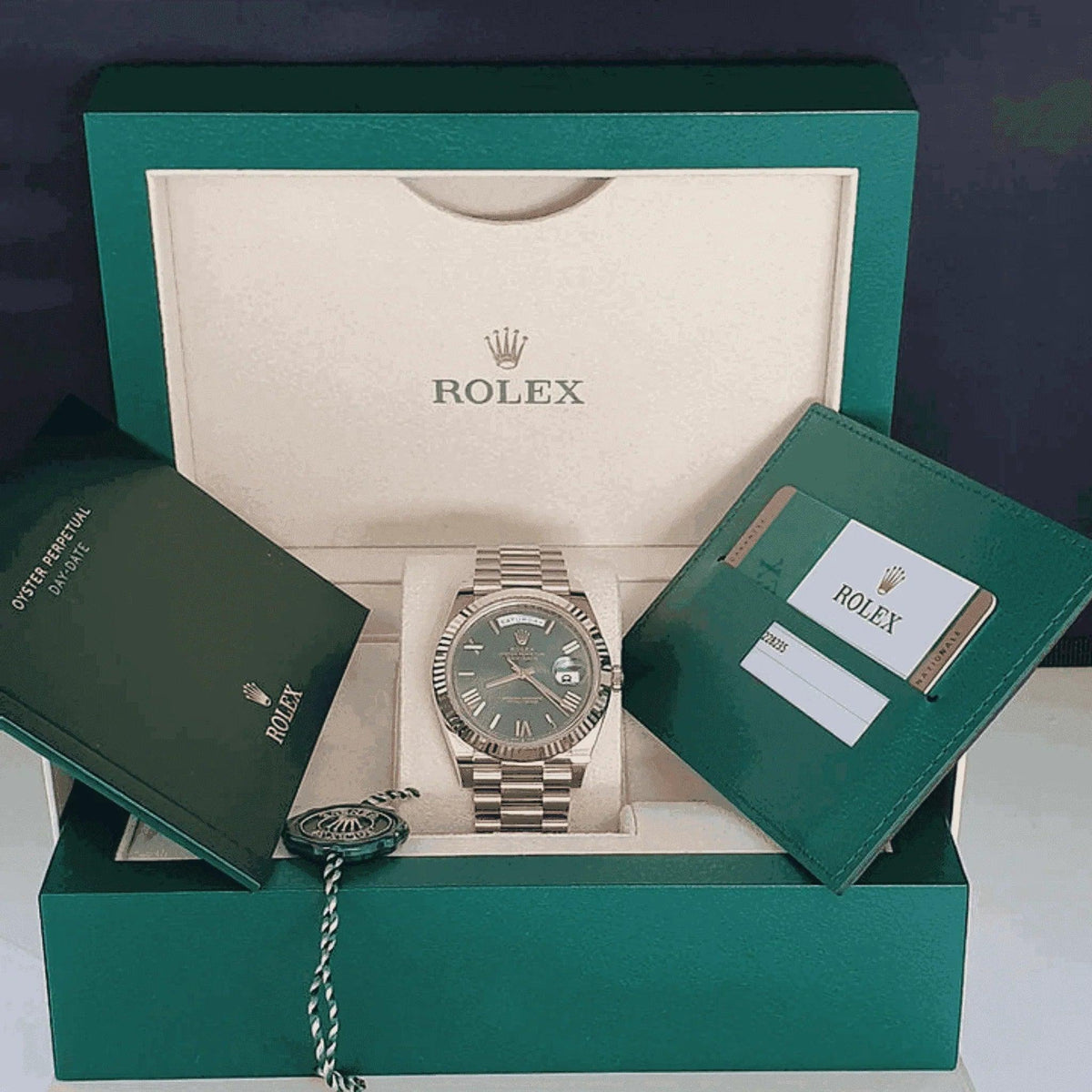 Rolex Day-Date Everose gold men's watch in box with warranty card and booklet
