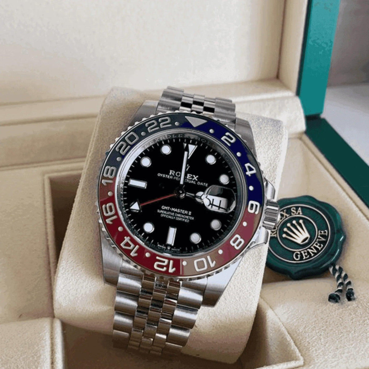 Rolex GMT-Master II Pepsi men's watch with red and blue bezel in display case