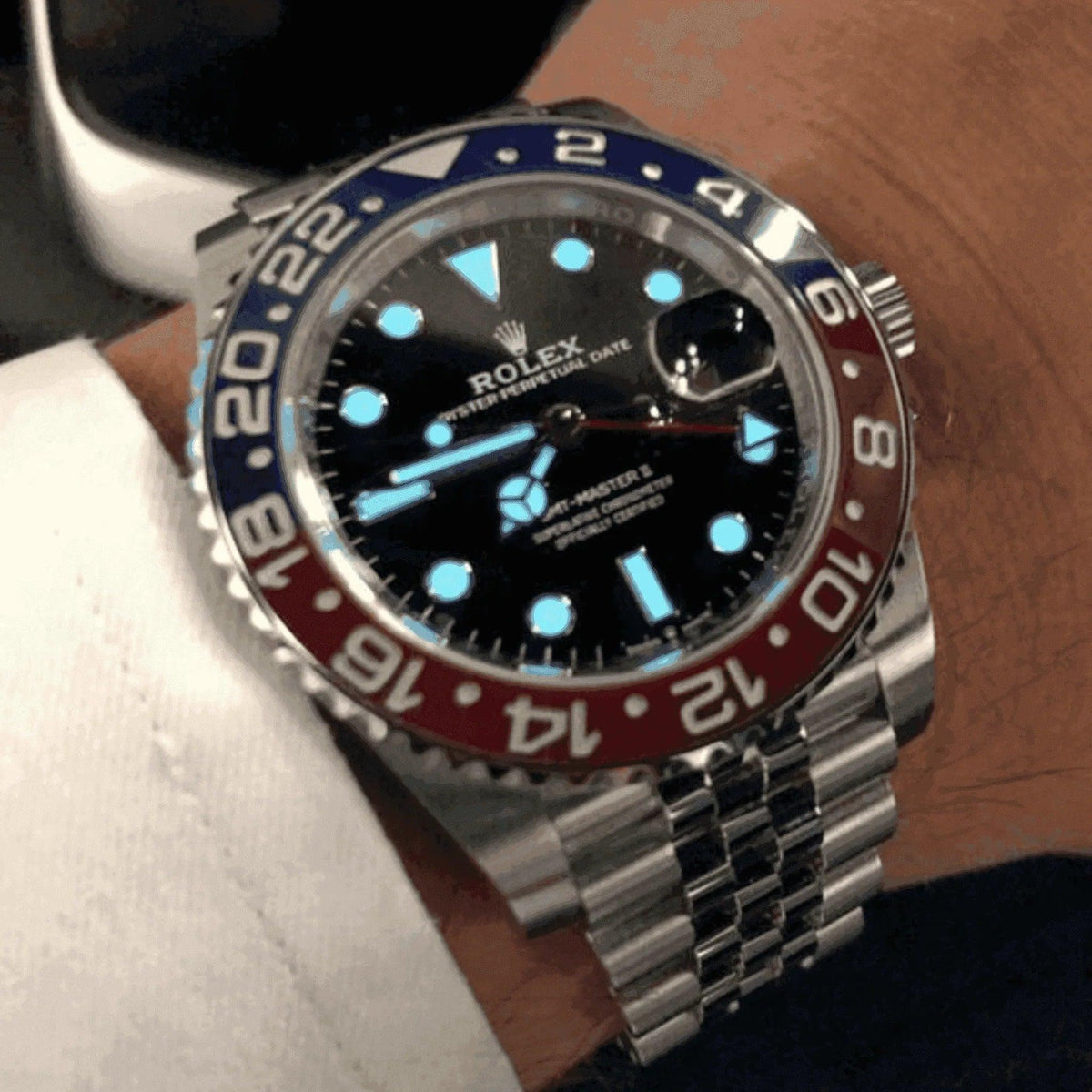 Rolex GMT-Master II Pepsi watch with blue and red bezel on man's wrist