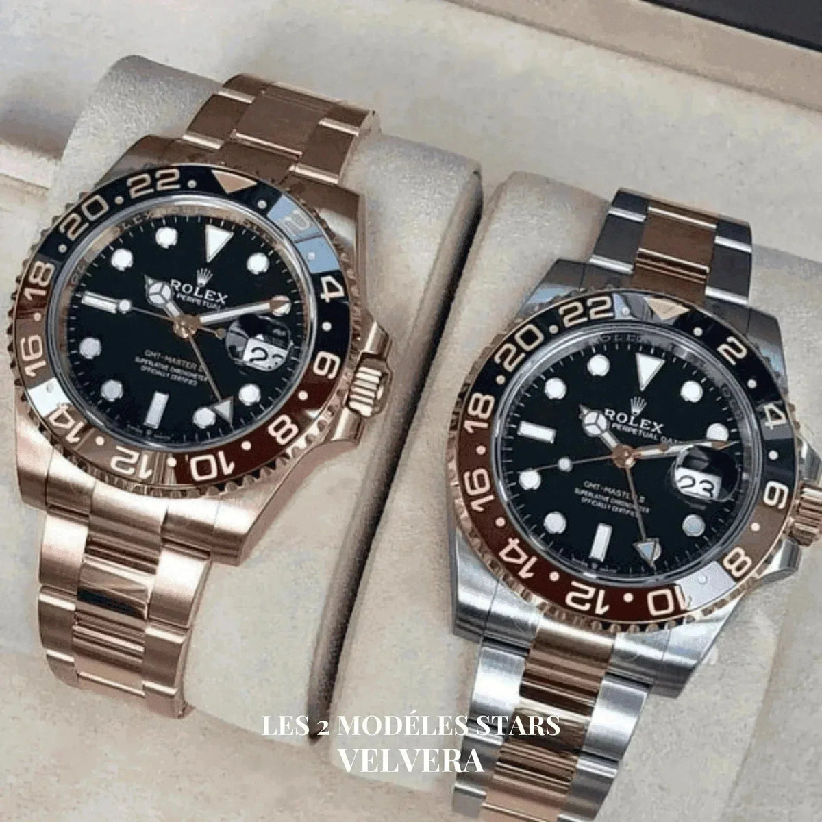 Two Rolex GMT-Master II Root Beer watches with black dials and two-tone bezels on display.